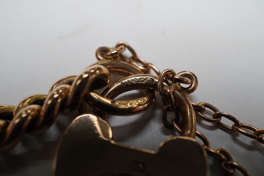 A 9ct god curb link bracelet, with heart shaped padlock clasp, 18cm, 13.8 grams. Condition - fair to good